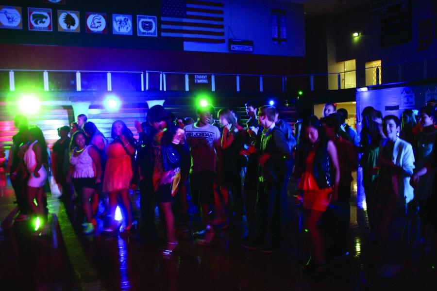 A packed LN Homecoming dance when neon light lit the scene.