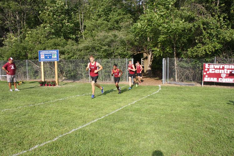 Members of the LCXC team continue running after exiting the portion of the course in the wood. The race on Tuesday was a 4K however the course can be altered to make a longer or shorter distance.