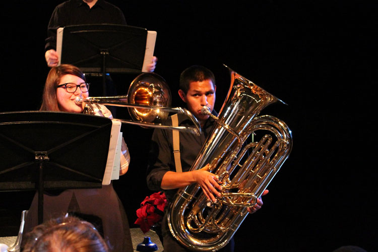 Senior Lucas Norrington and Junior Alison Shaner play their brass instruments at the Swing Dance Concert. The two were part of numerous musical groups that performed at the event.