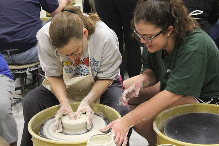 Art students throw pottery with blind, visually impaired