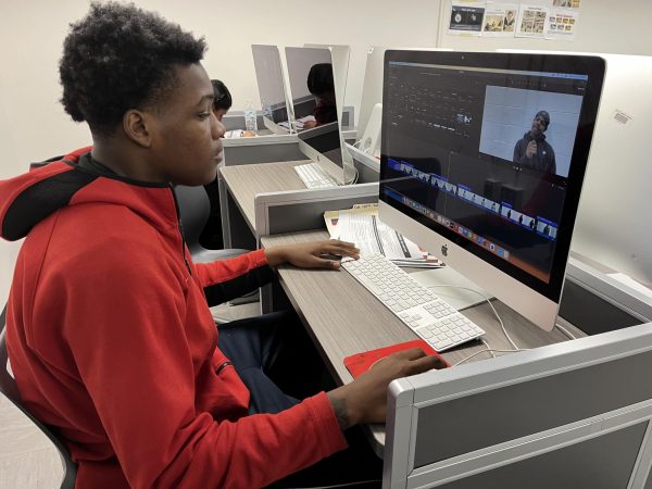 Media student Terrell Sword, senior, edits a video segment for Cat's Eye during one of the first semester production cycles. Students in Wildcat Media can work on content for either newspaper, yearbook or broadcast. 