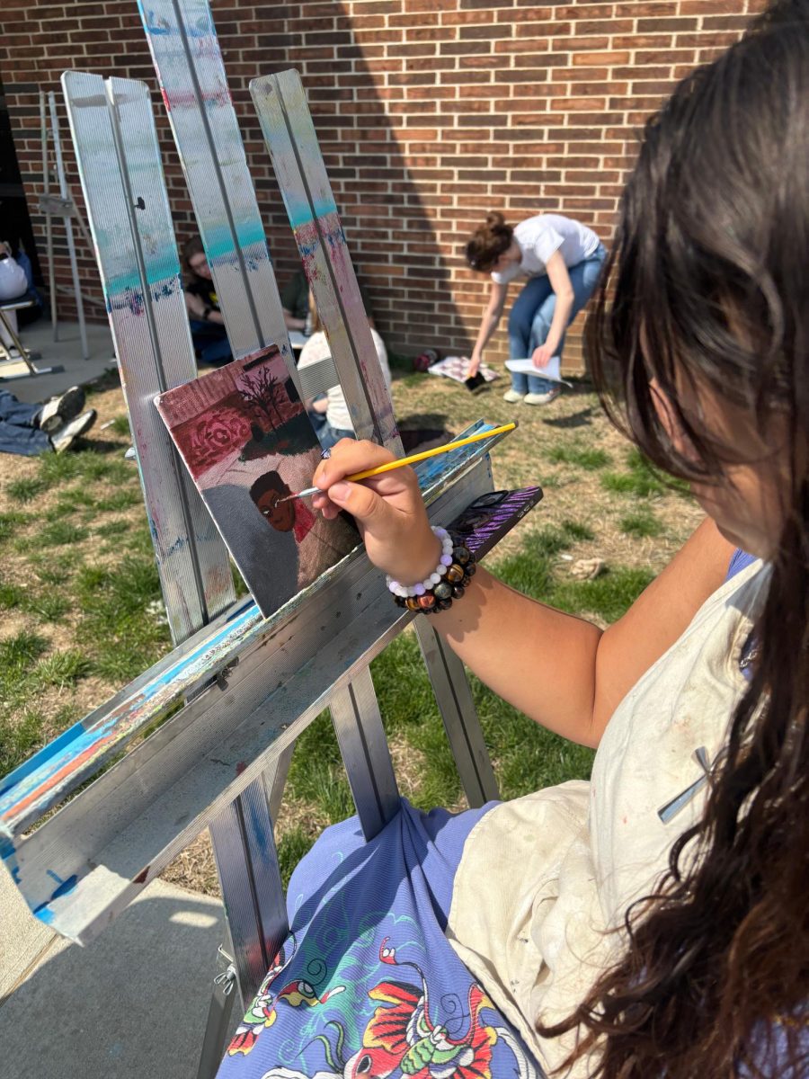 Students in Ashley Buschatzke’s art science class work on an outdoor painting activity, using the natural setting as inspiration during a class period.