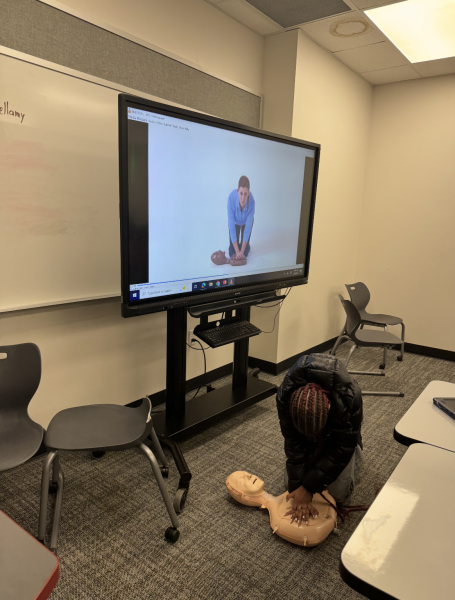 Second year exercise science students practice learning the proper technique and mechanics for CPR. 